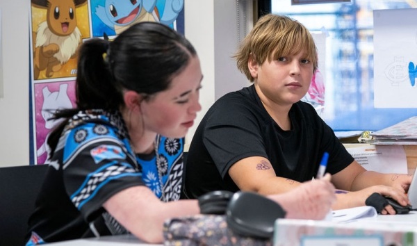 Two students working at the Youth Futures Community School Midland