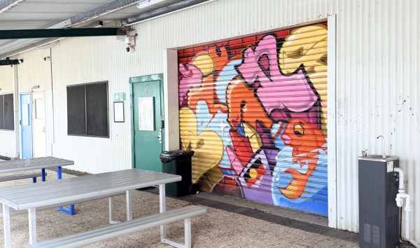 Some benches and a wall mural at the Youth Futures Community School in Midland
